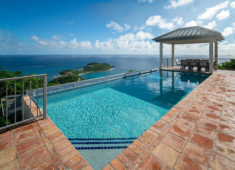 Stylish villas like this, with a dining gazebo and a large pool overlooking the sea, offer insight into why celebrities have chosen to live on the Virgin Islands and why it remains a popular vacation destination.